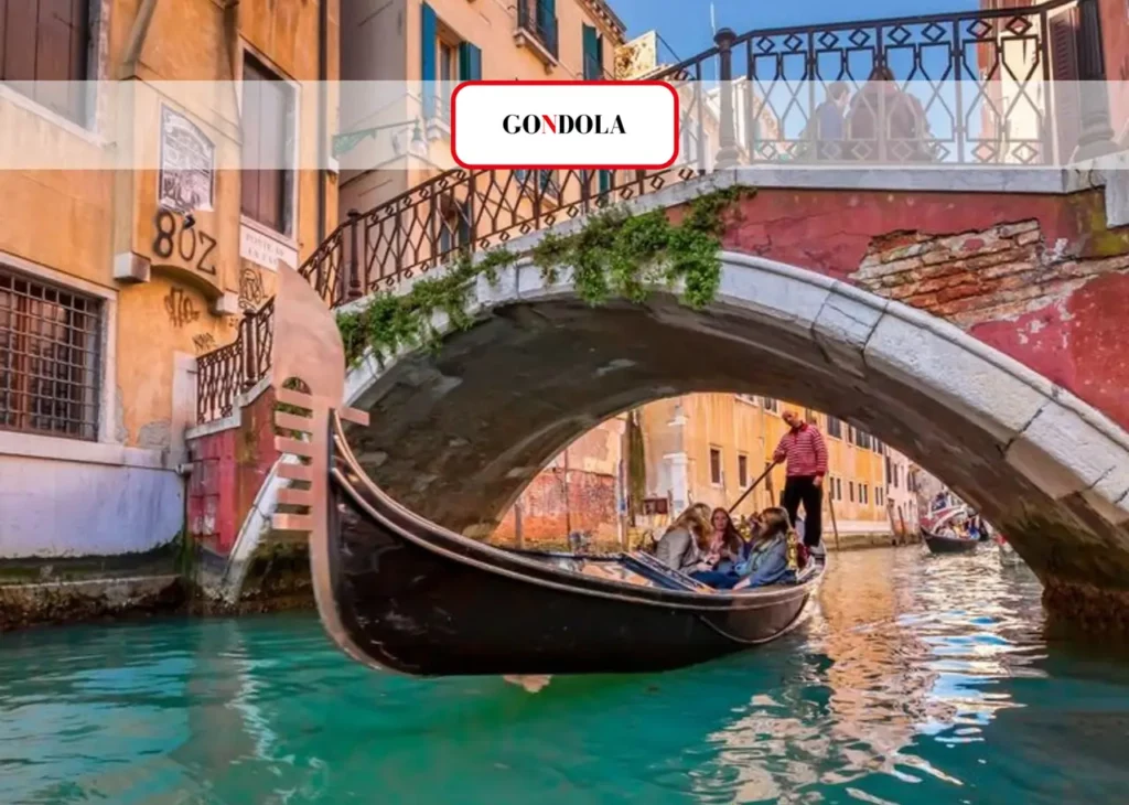 Gondola passing under a bridge in Venice