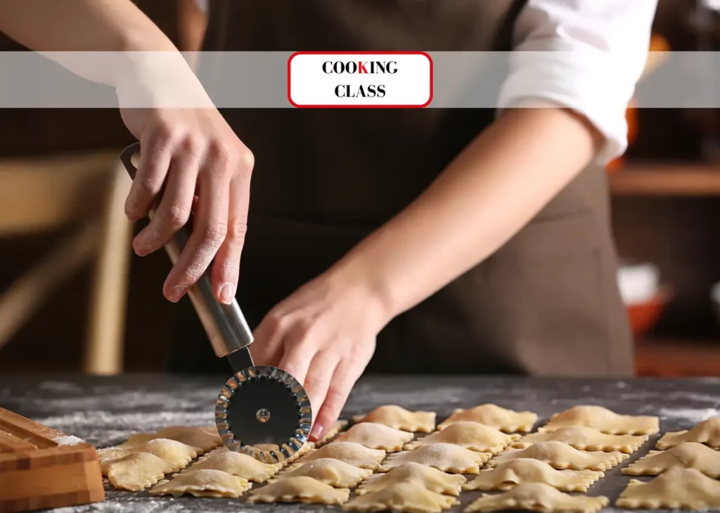Person making fresh pasta during cooking class