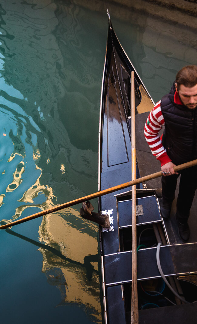 gondolier in the grand canal